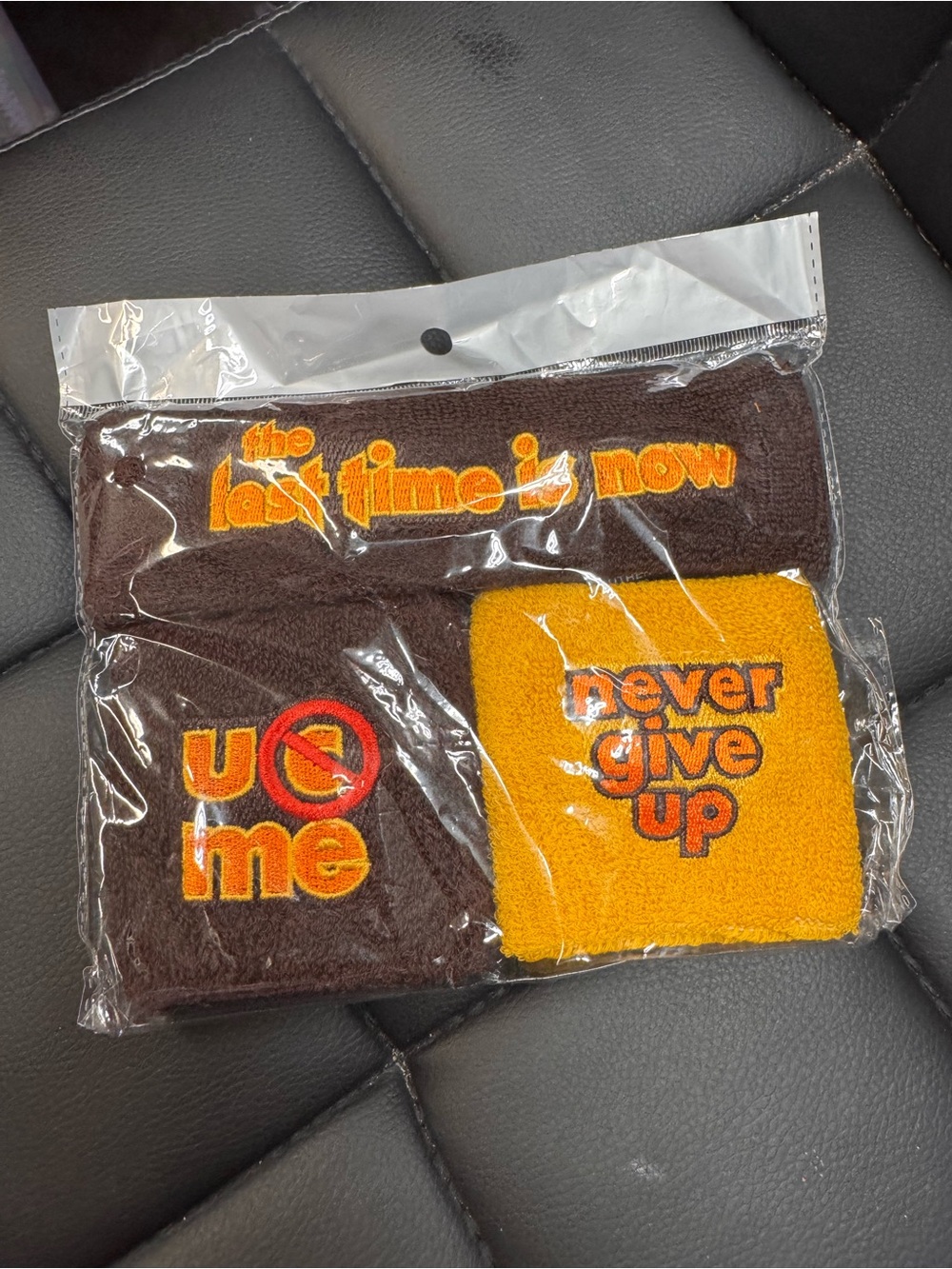 WWE Brown and Orange 'Never Give Up' Wristbands & Headband Set